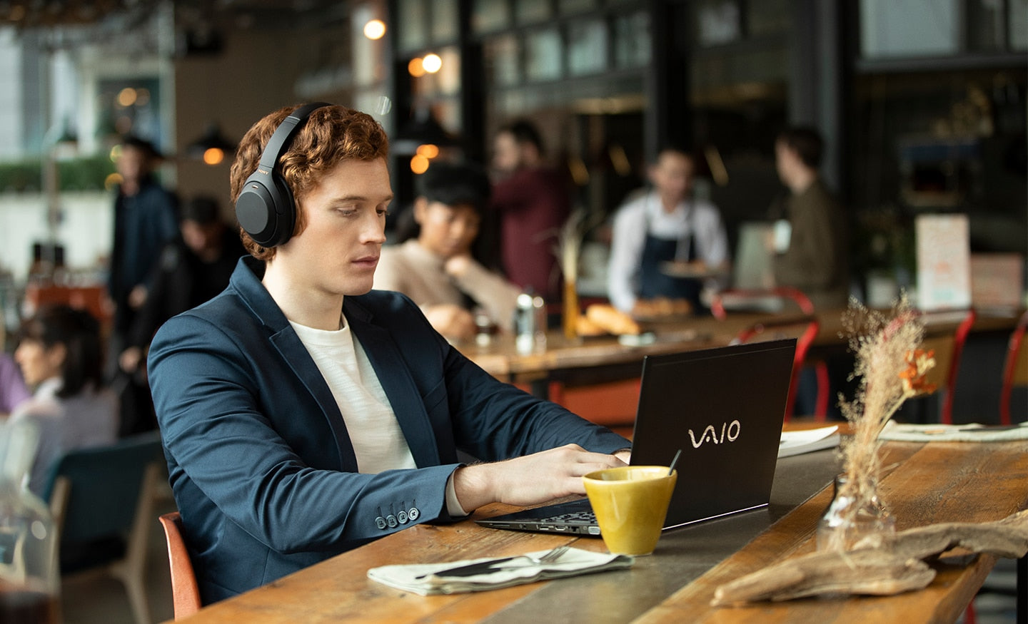WH-1000XM4 on a man in a restaurant